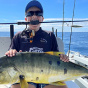 Одиннадцатилетний австралиец поймал крупного золотого каранга и установил два мировых рекорда