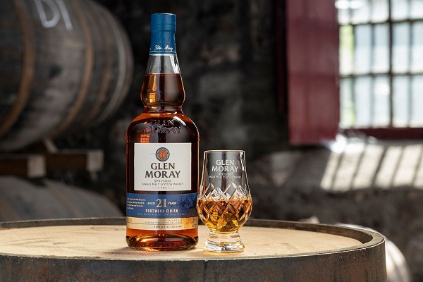 Glen-Moray-21-Year-Old-whisky-with-glass-on-a-barrel.jpg