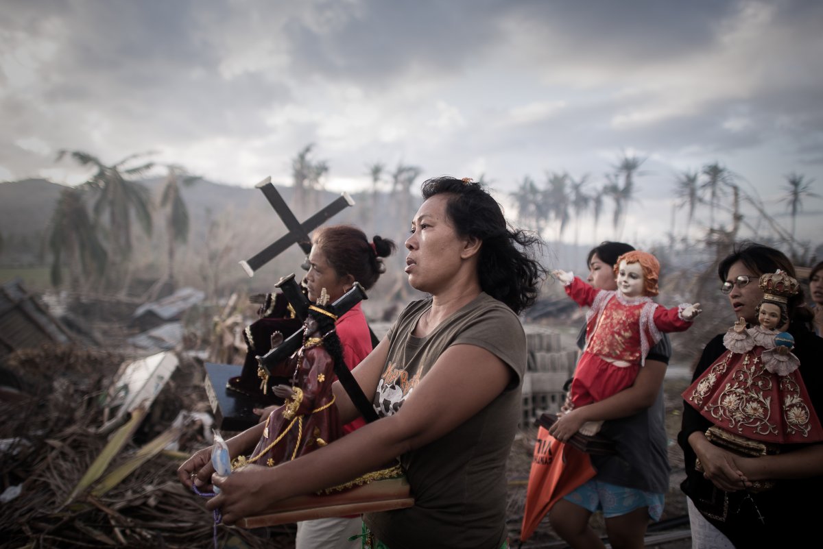 last-november-typhoon-haiyan-destroyed-large-parts-of-the-philippines-leaving-more-than-4-million-homeless-and-killing-more-than-8000-people-here-survivors-march-during-a-religious-procession